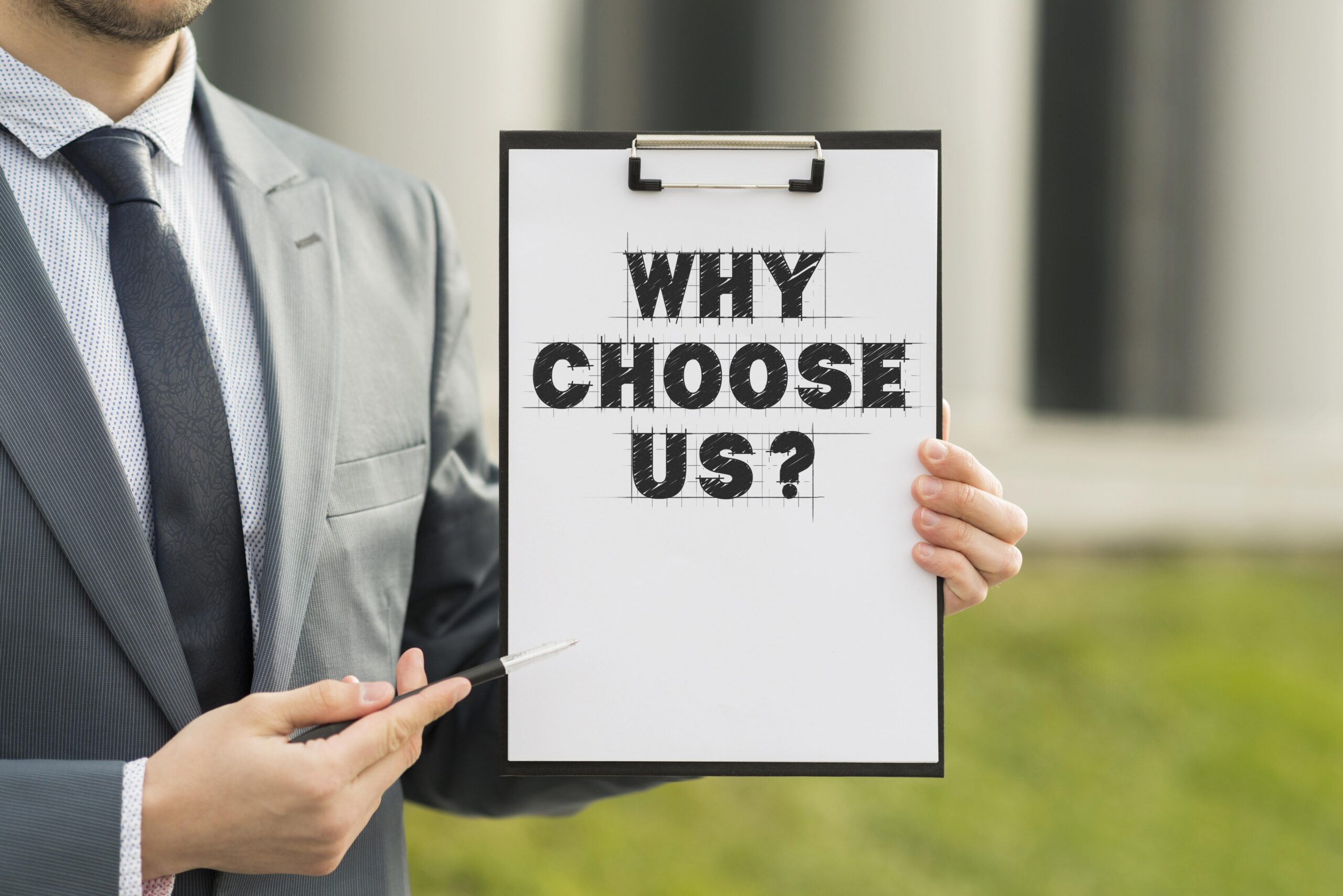 business man holding clipboard with why choose us question